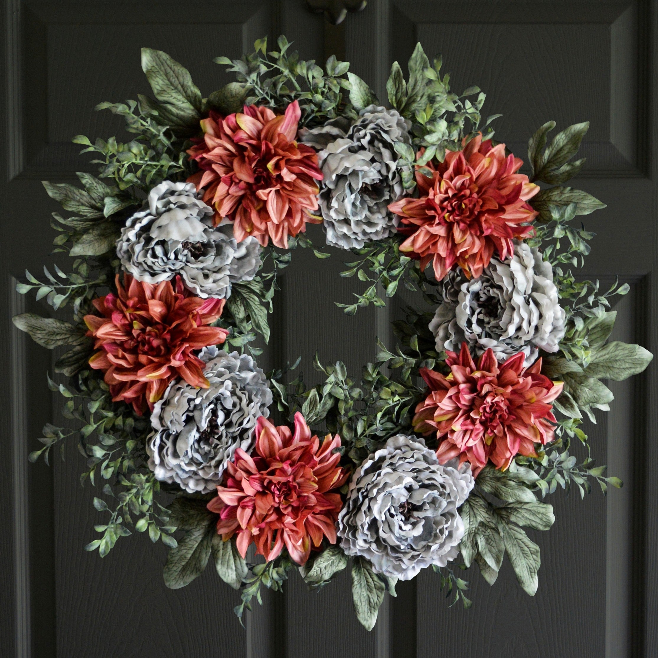 peony and dahlia wreath on a dark door