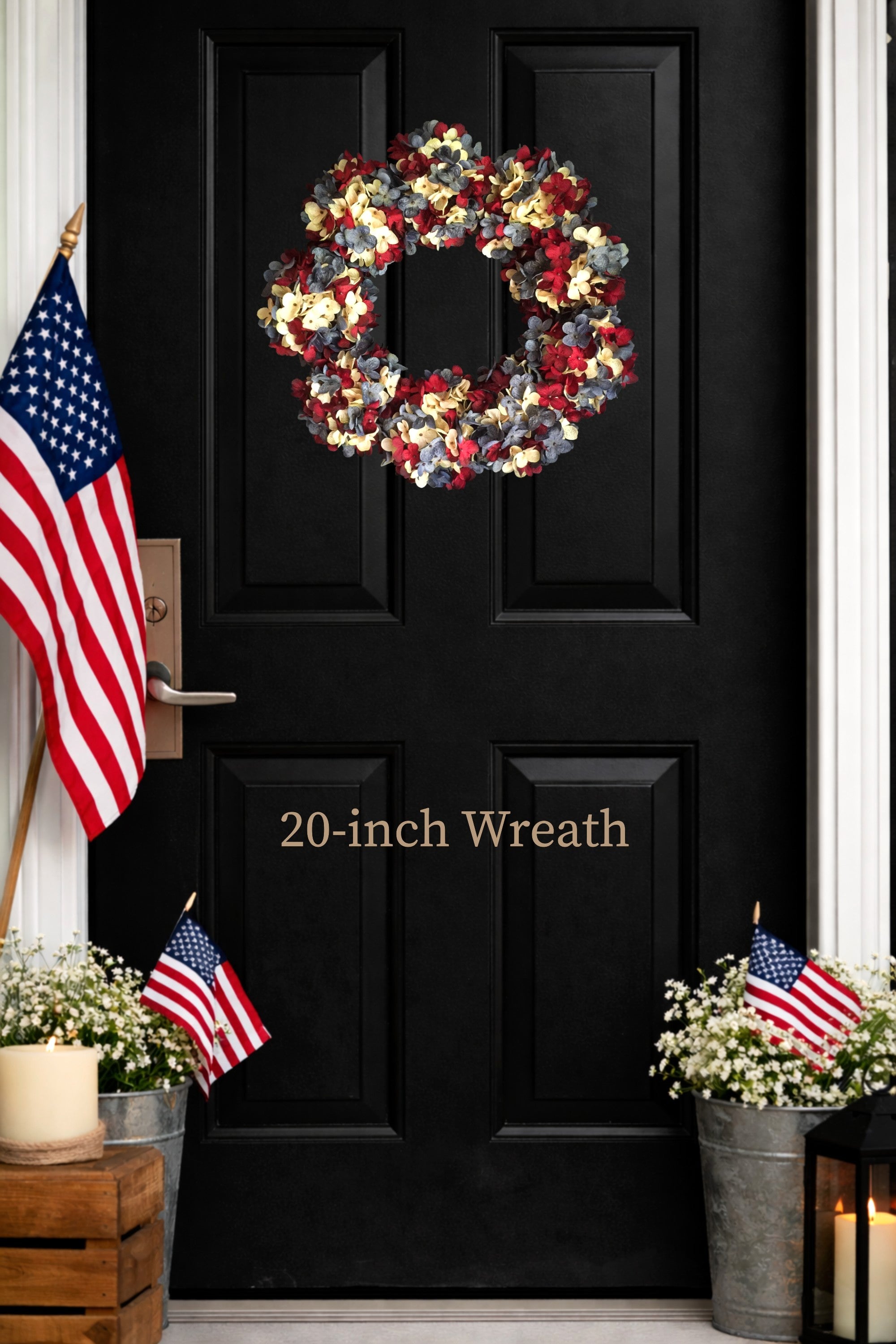  patriotic wreath on a black door with American flags and plants.