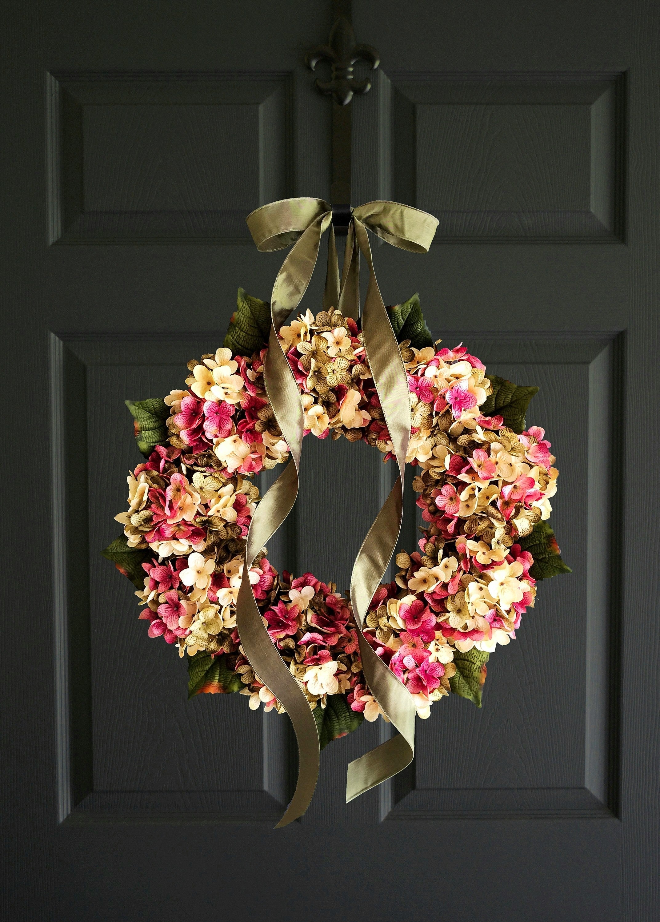 hydrangea door wreath in pink green cream colors on dark door