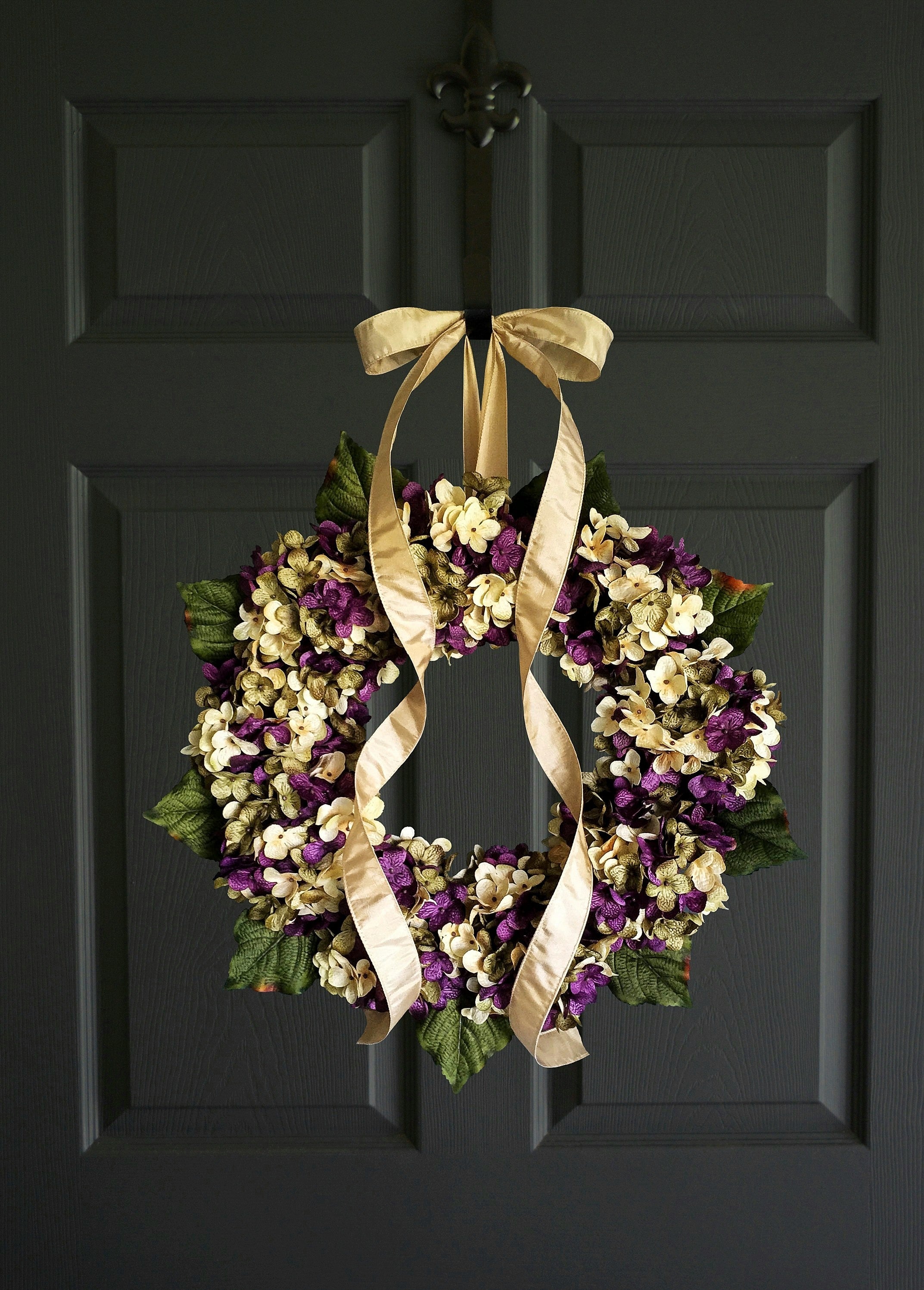 hydrangea door wreath made in purple green cream colors on dark door