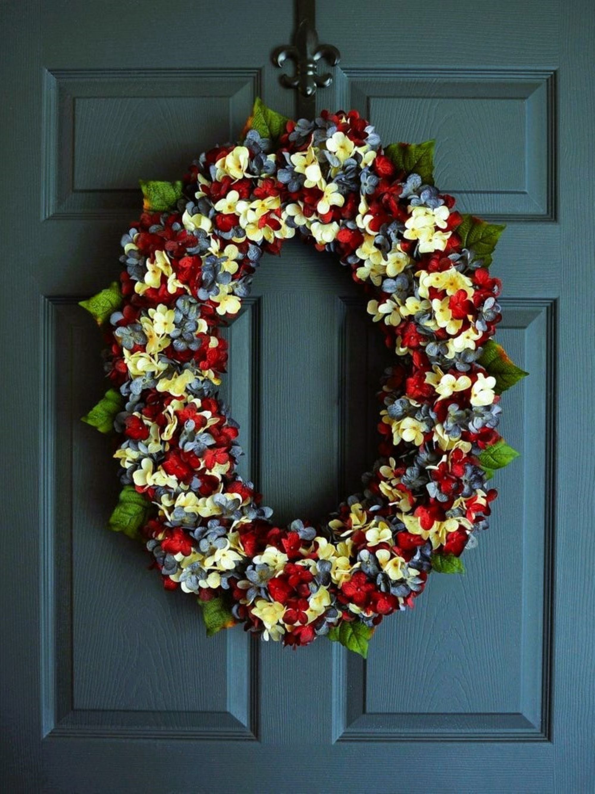 Large Americana oval wreath showing size scale on standard front door