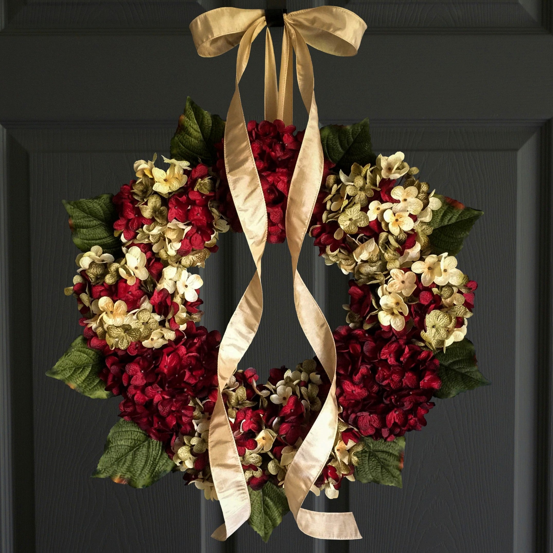 Handmade red hydrangea front door wreath with lush silk flowers and greenery on a farmhouse style grapevine base