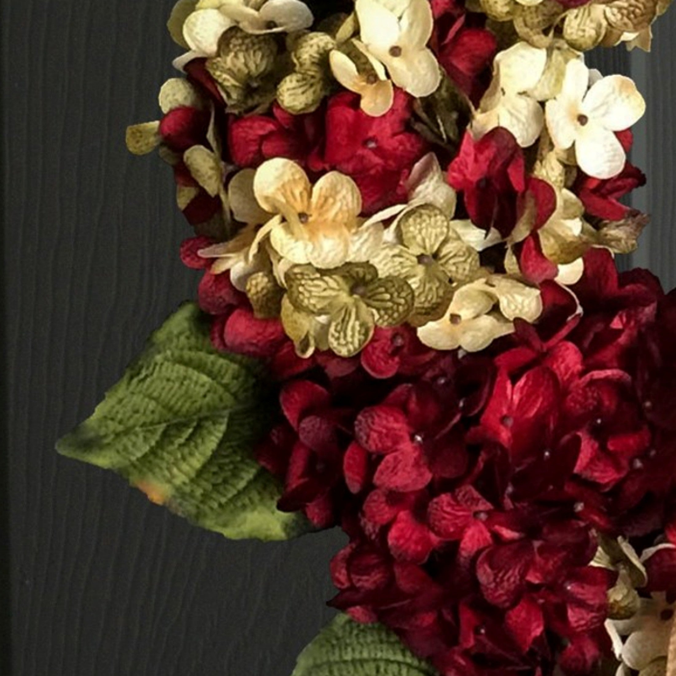 Close-up of premium silk red hydrangea flowers on handmade front door wreath