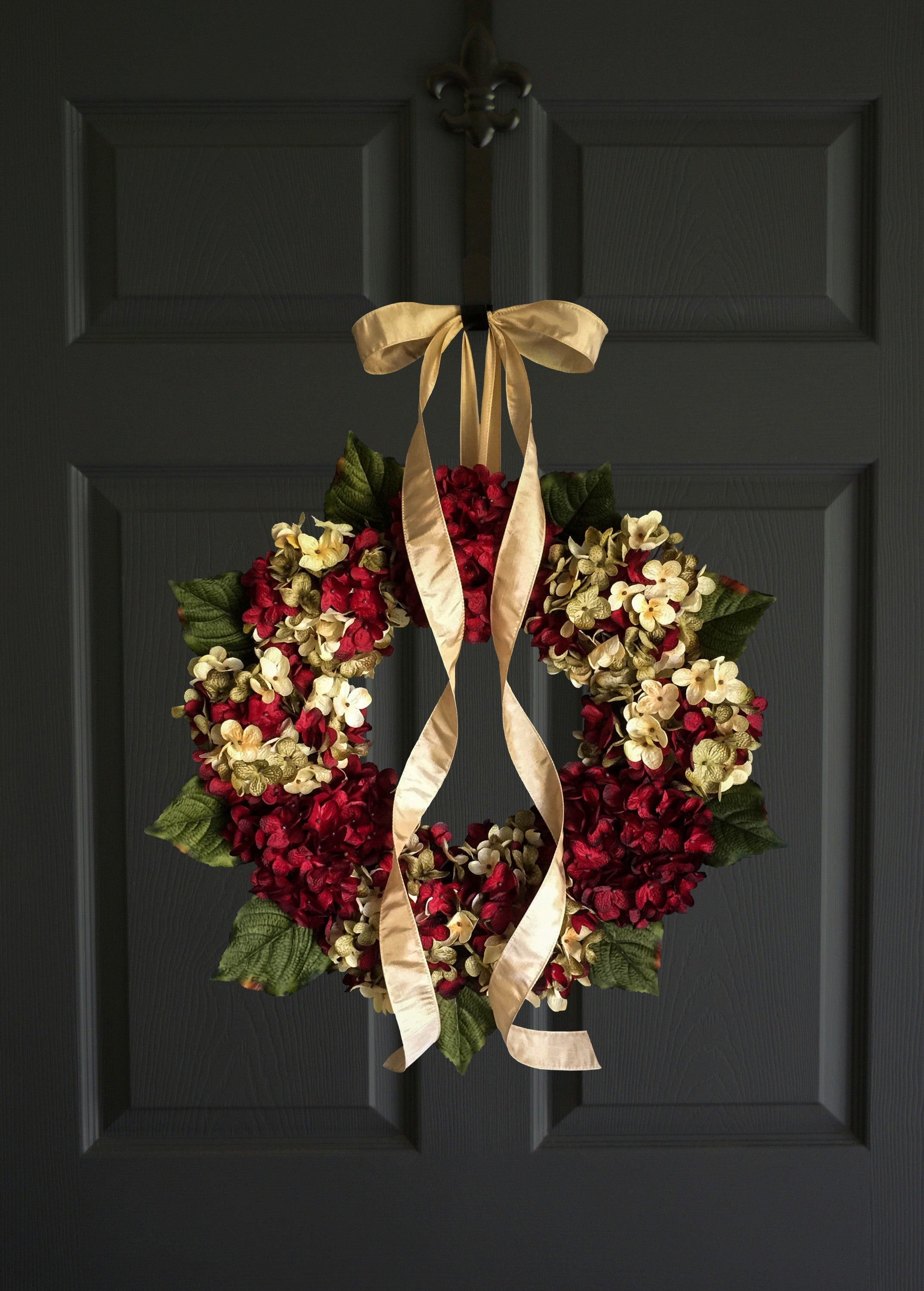 Elegant red hydrangea wreath decorating a covered front porch entryway