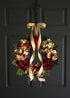Elegant red hydrangea wreath decorating a covered front porch entryway