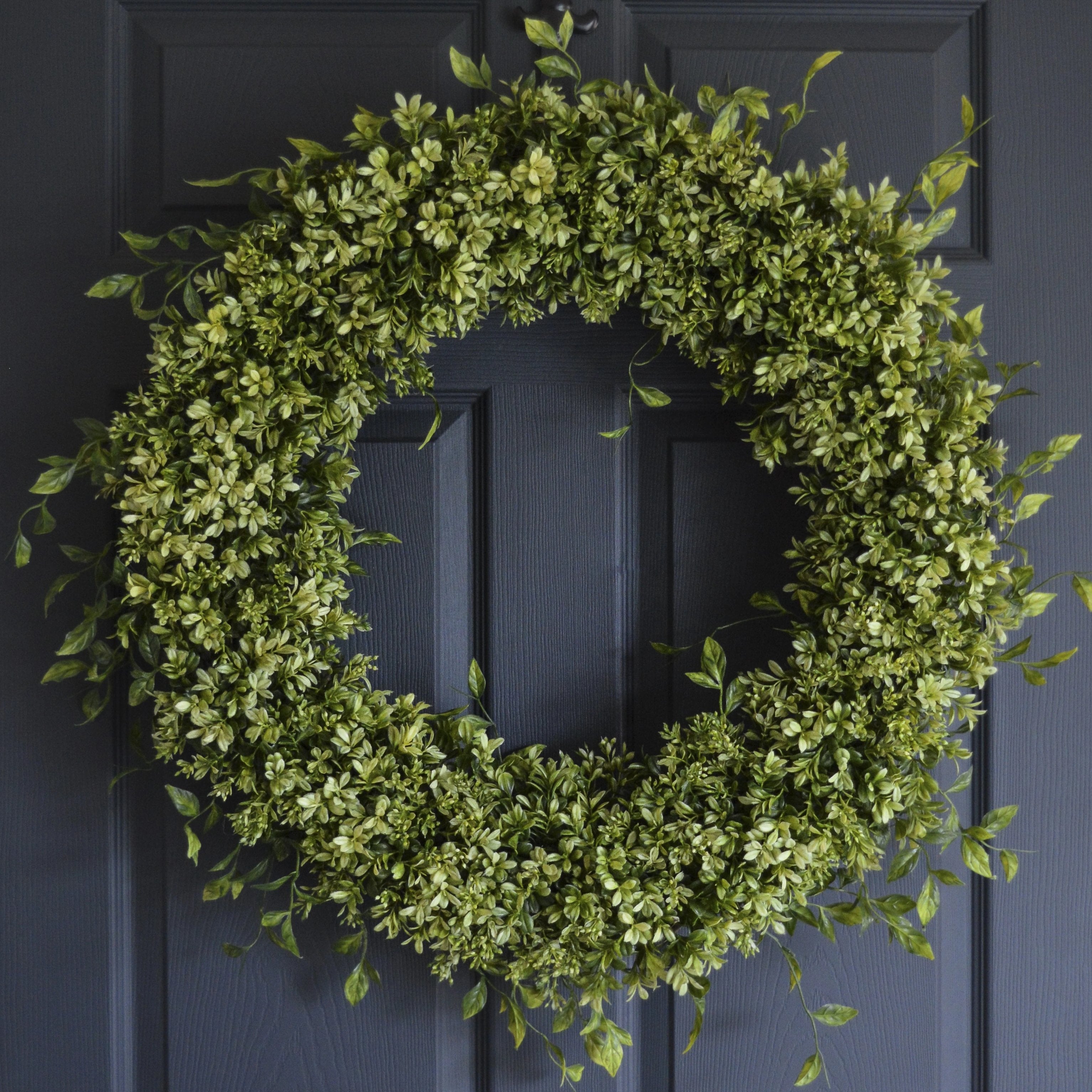 large boxwood wreath on front door